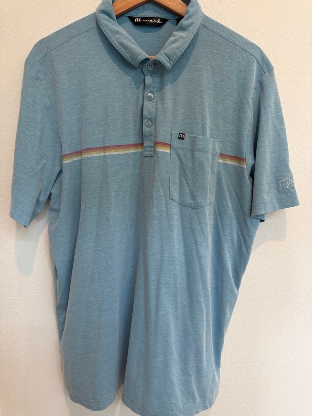 Travis Mathew Men's Sky Blue Polo with Subtle Rainbow Stripe